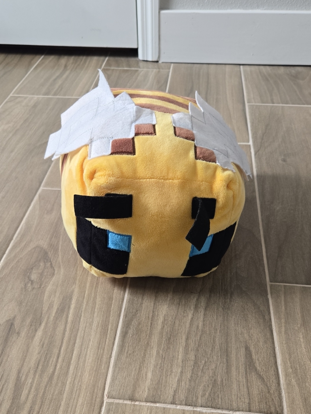 Yellow Plush Square Character Toy with Blue Eyes